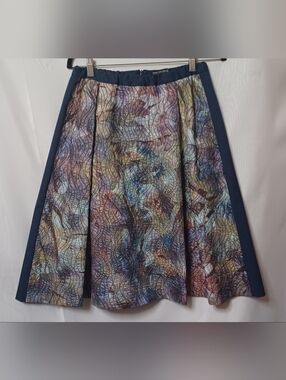 The People's Multi-color Pattern Pleated Front with Navy Back Skirt. Size 12